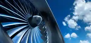 Aircraft engine fan blades against a blue sky