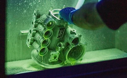 Aircraft component undergoing fluorescent penetrant inspection at Air Support