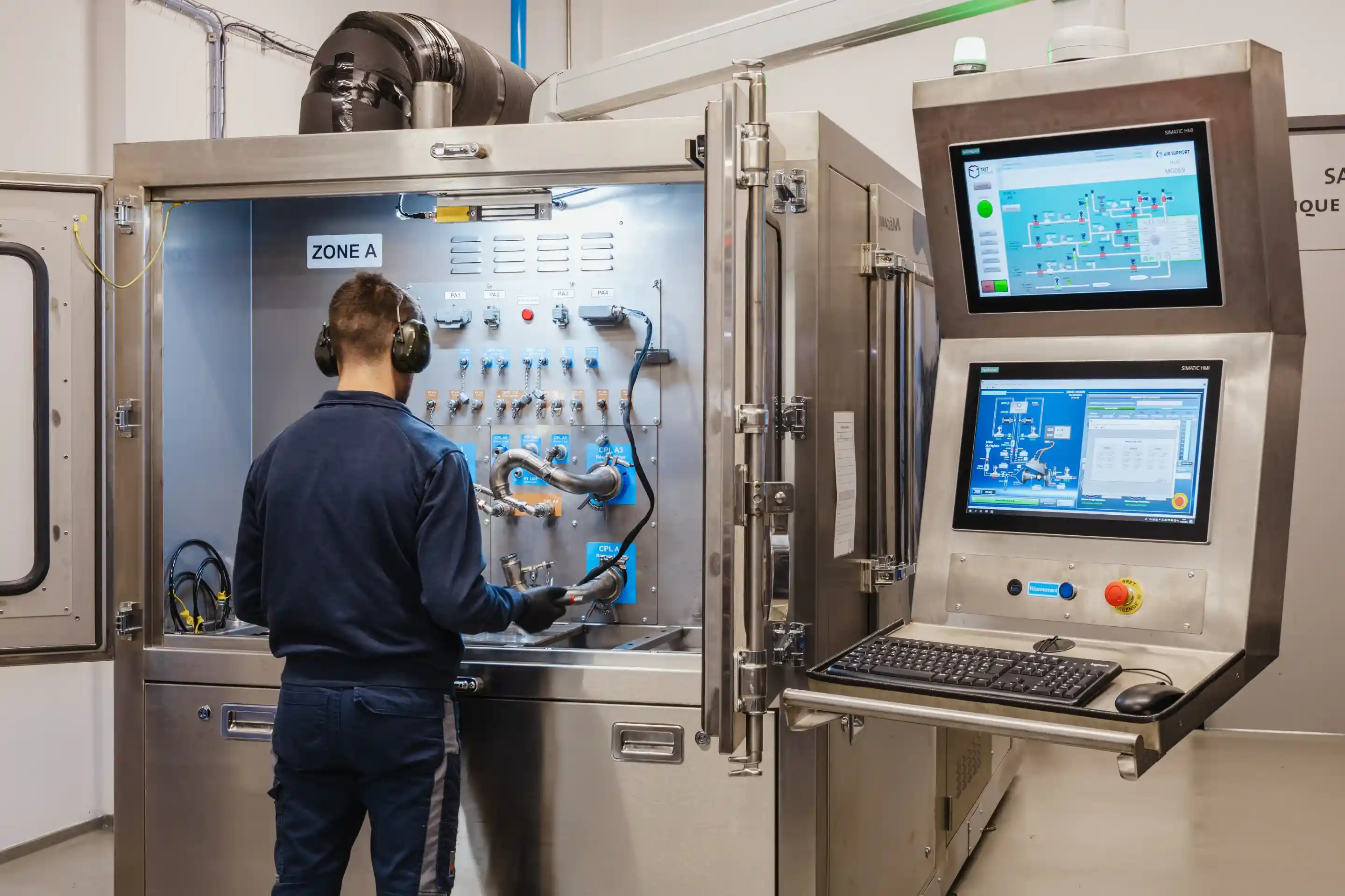 Air Support technician operating an automated test bench for aircraft components