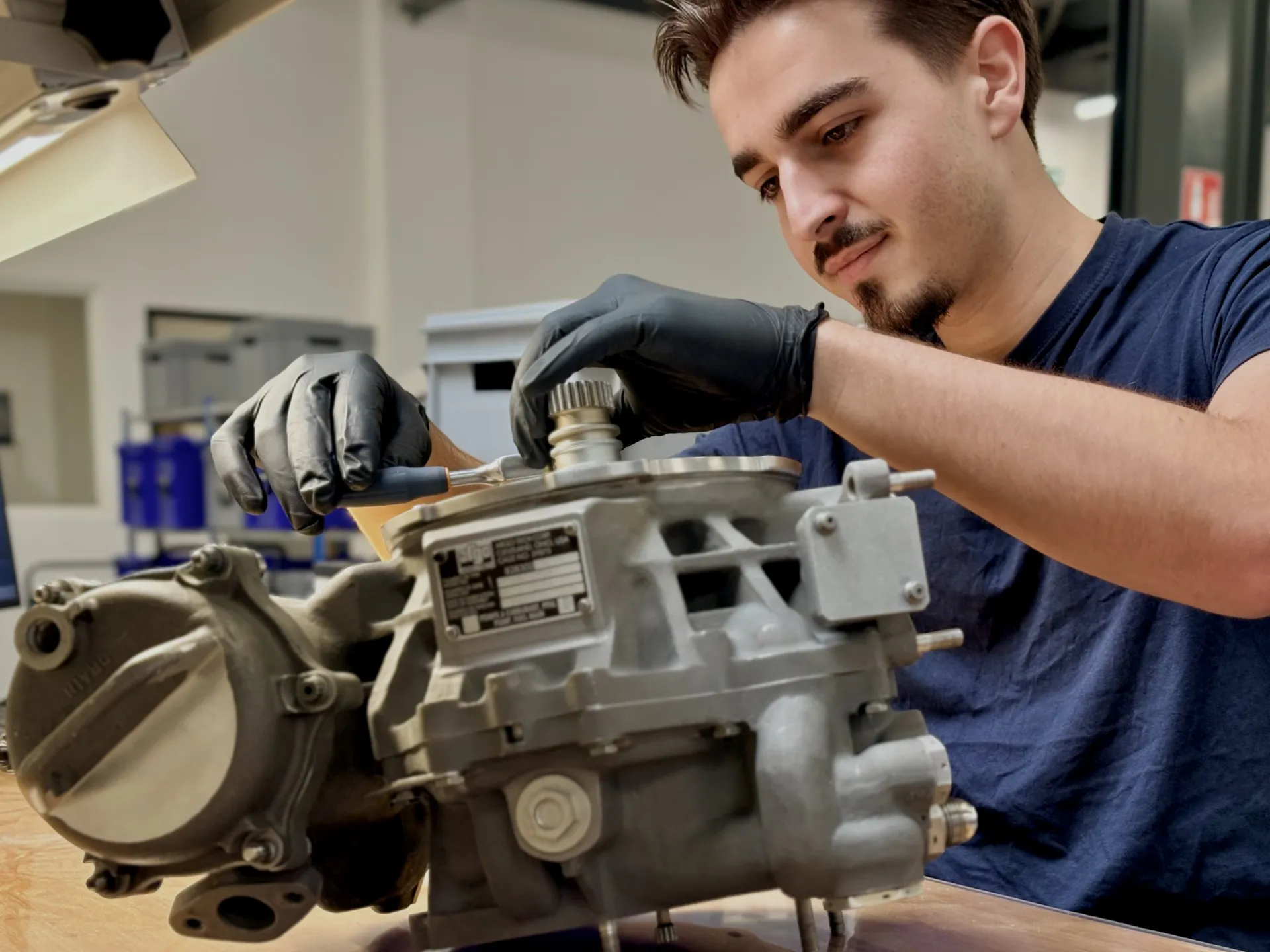 Air Support technician repairing an aircraft fuel system component