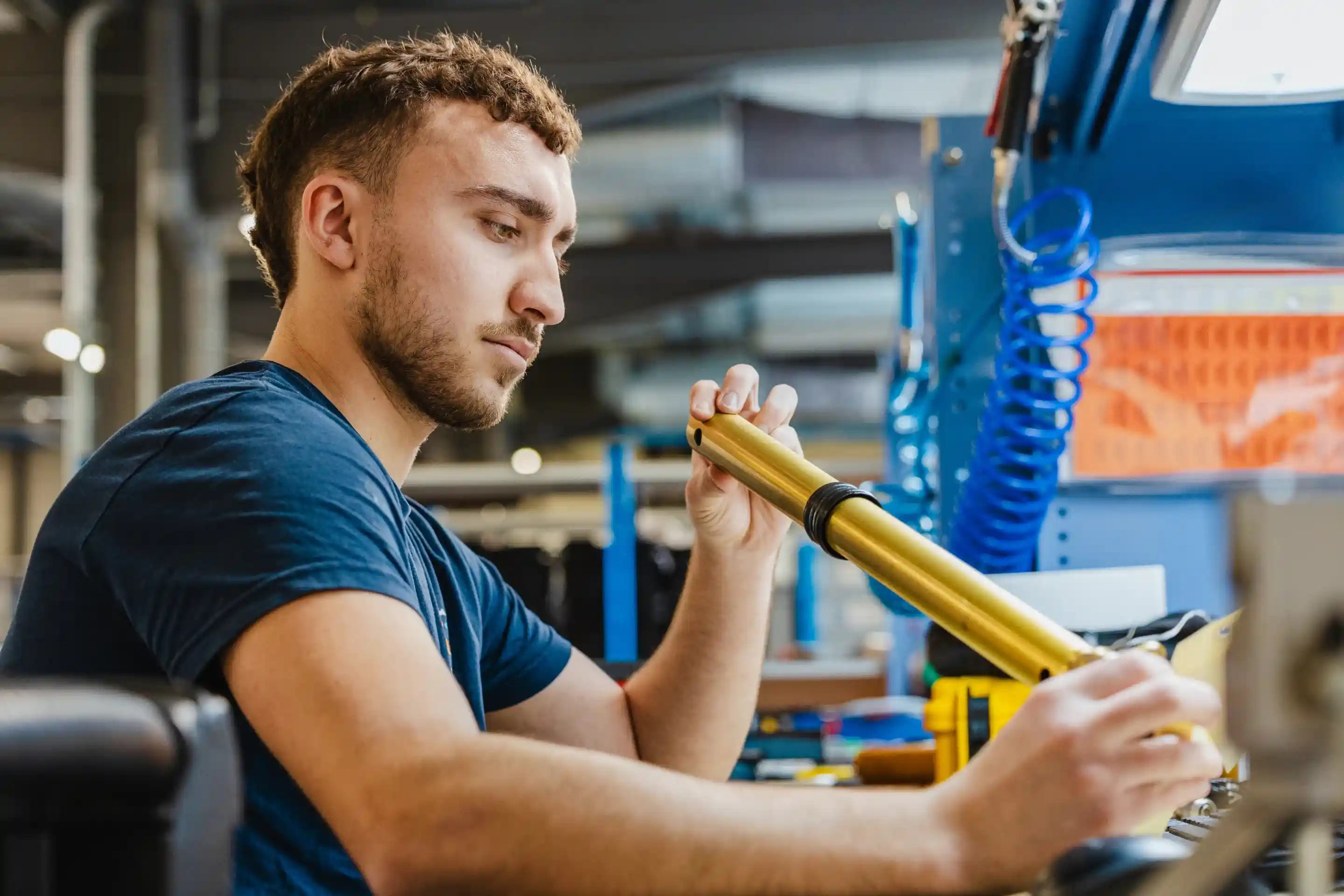 Air Support technician inspecting an aircraft sensor during maintenance