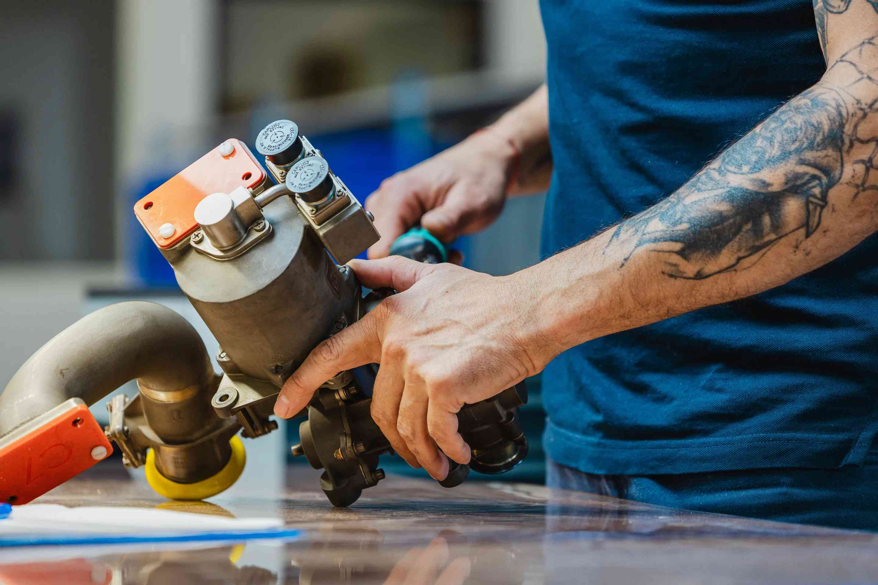 Air Support technician maintaining an aircraft valve component