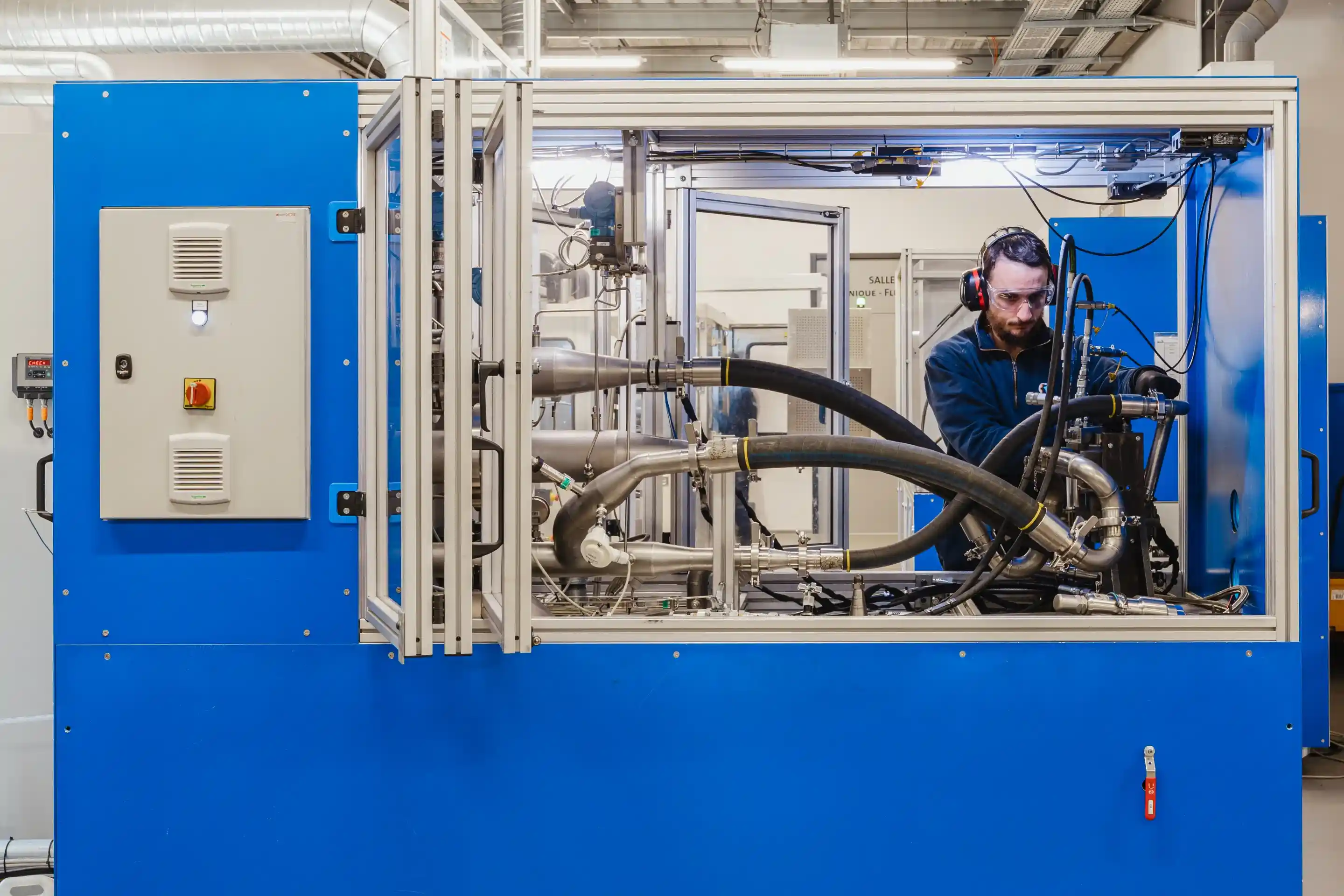 Air Support technician testing an aircraft component on a specialized test bench